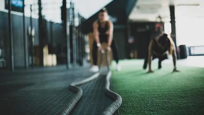 athletics, woman working out with heavy ropes