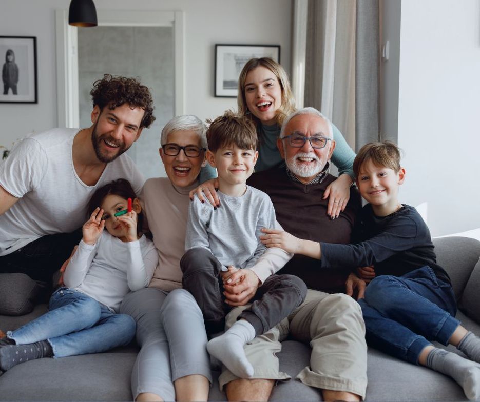 Family sitting together on sofa